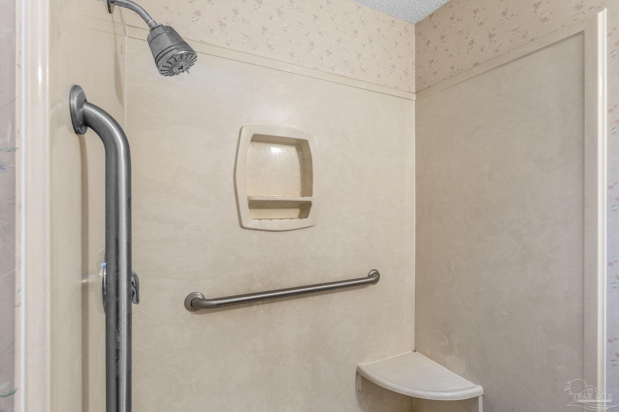 426 Brown Place Crestview, FL 32539 - Photo 26 of 40 a bathroom with a shower and a mirror