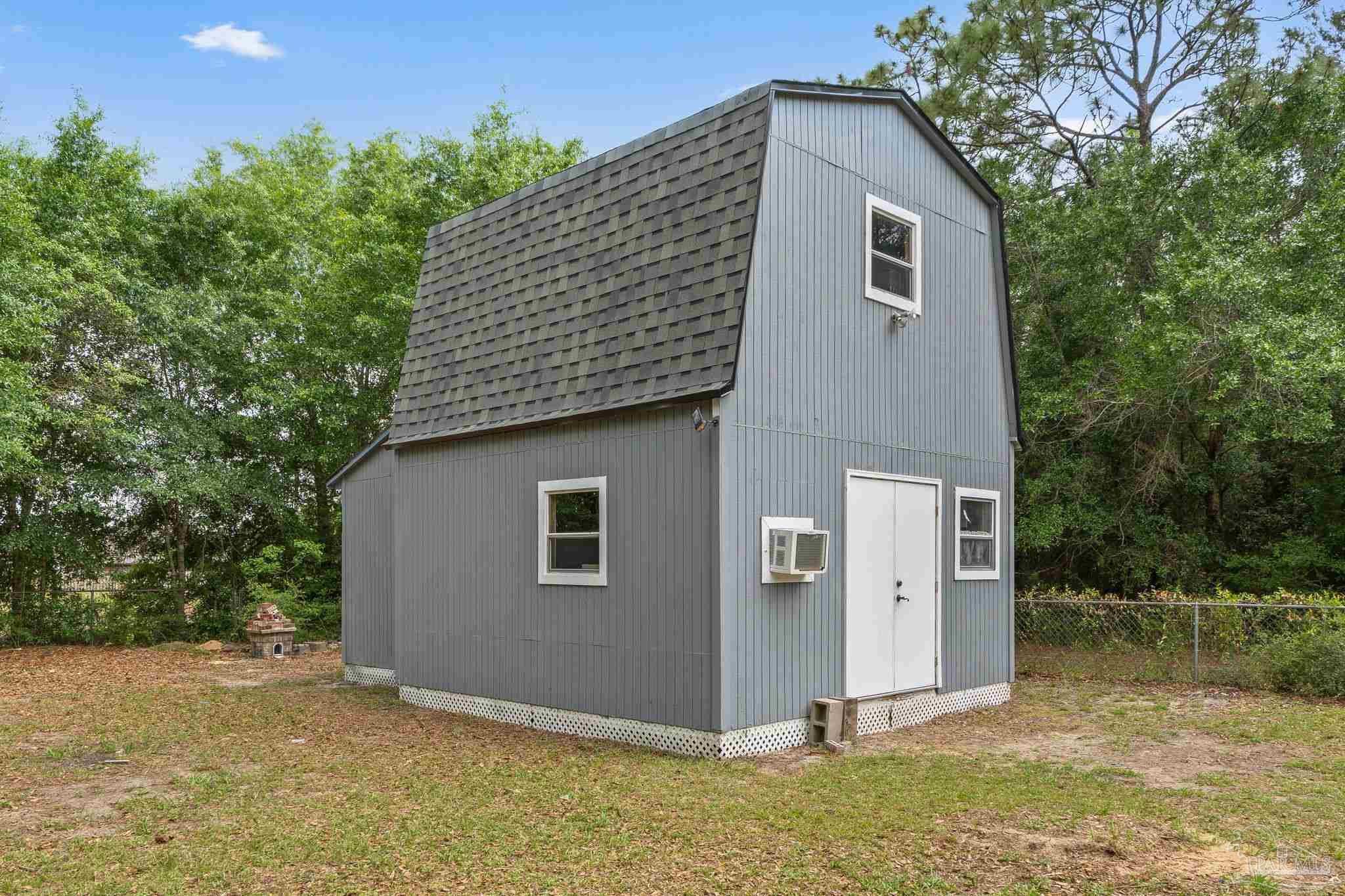 426 Brown Place Crestview, FL 32539 - Photo 3 of 40 a house that has a tree in front of it