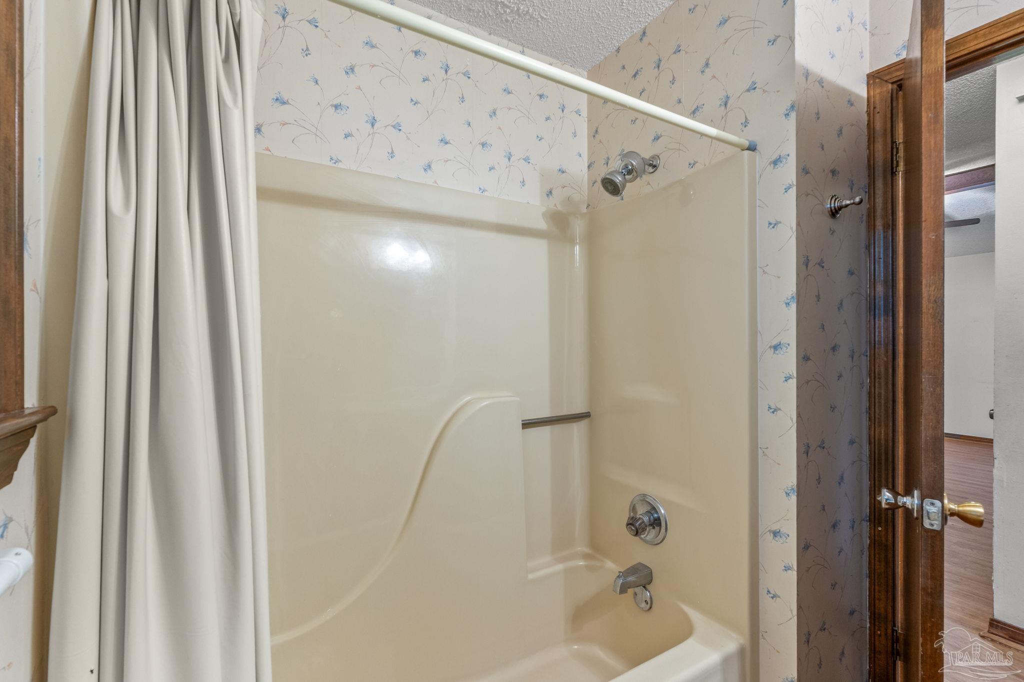 426 Brown Place Crestview, FL 32539 - Photo 33 of 40 a bathroom with a shower and a tub