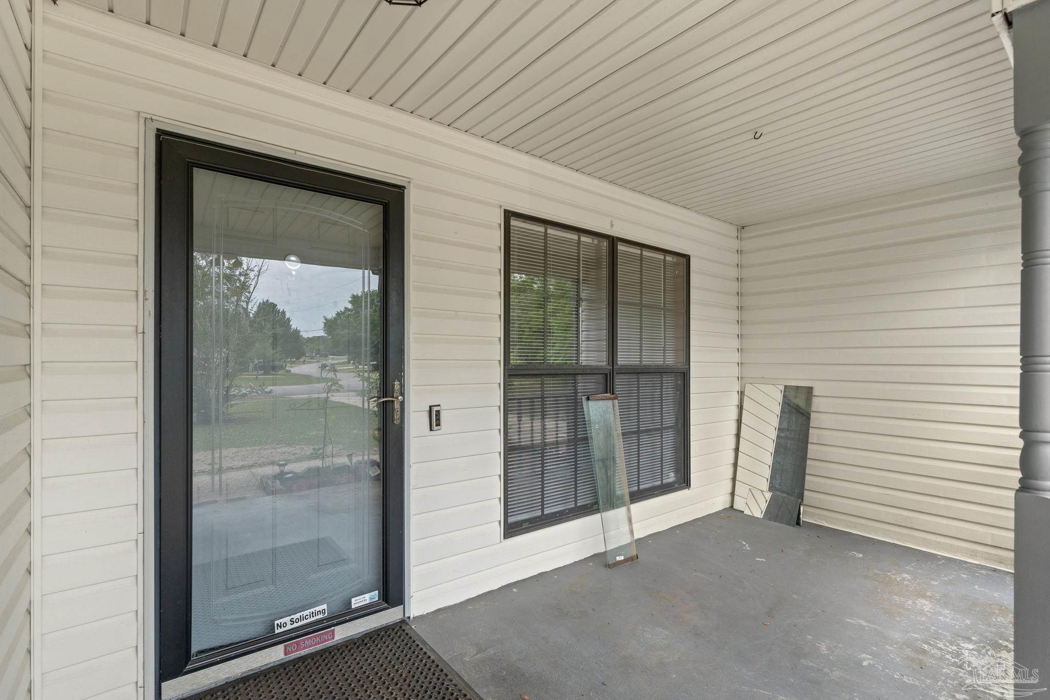 426 Brown Place Crestview, FL 32539 - Photo 7 of 40 a view of a front door and wooden floor