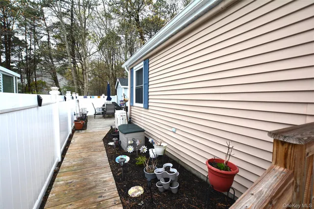 a bedroom with a bed dresser and a window