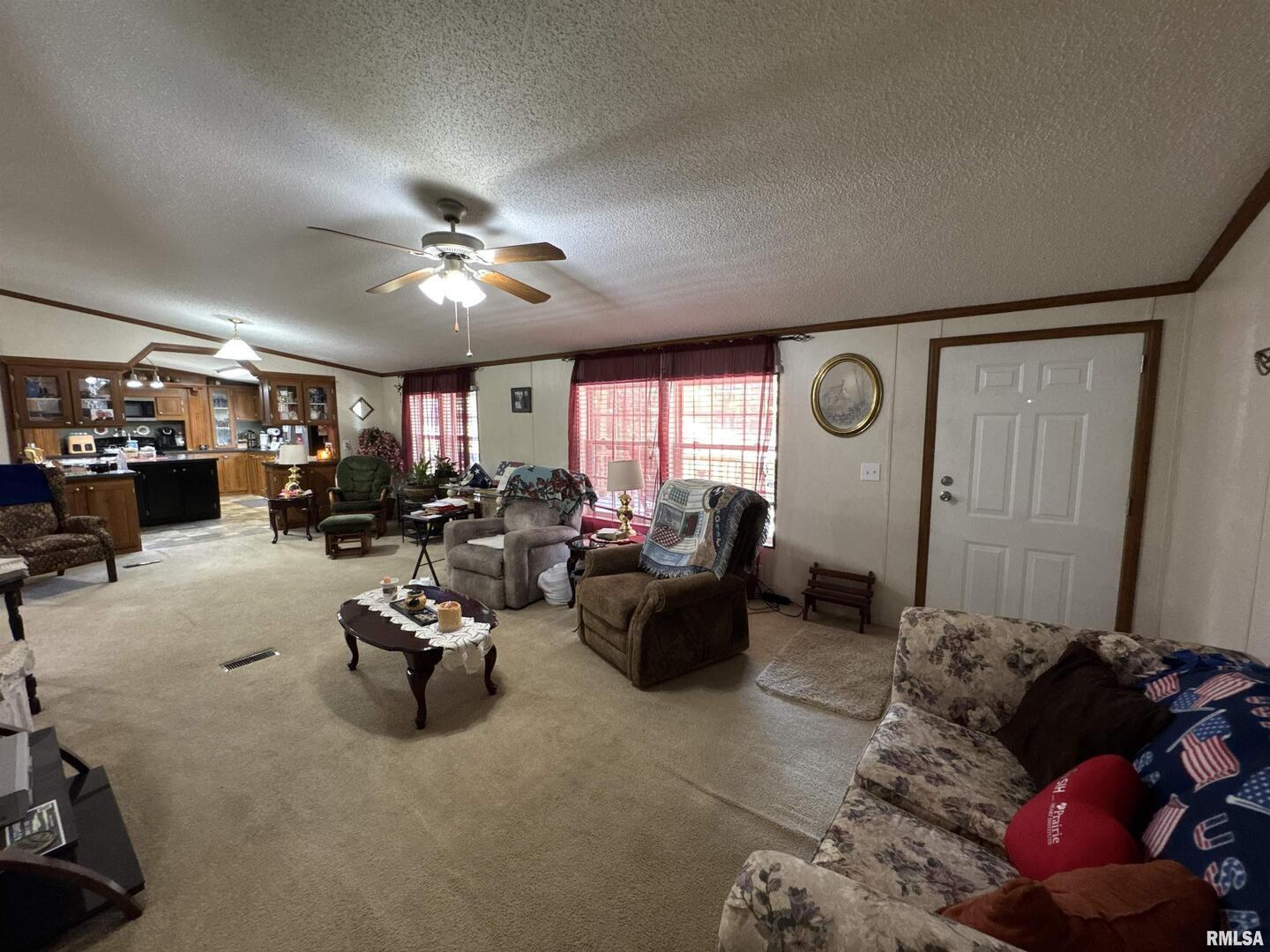 3920 Herrin Road Carterville, IL 62918 - Photo 6 of 34 a living room with furniture gym equipment and a large window