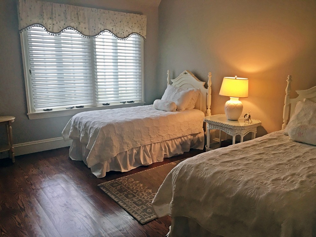 77 Cliff Road Wellesley, MA 02481 - Photo 16 of 29 a bedroom with two beds and a window