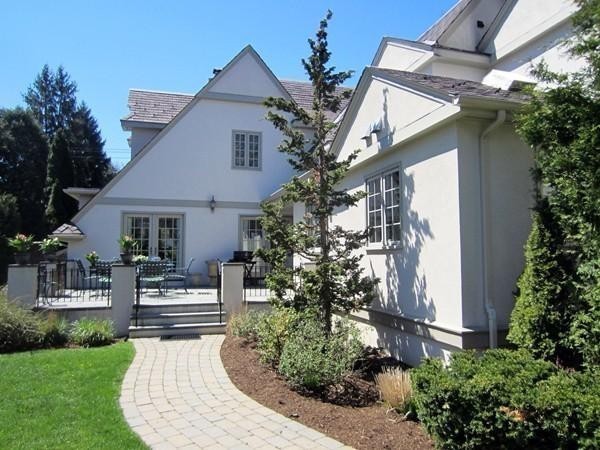 77 Cliff Road Wellesley, MA 02481 - Photo 21 of 29 a front view of a house with a garden