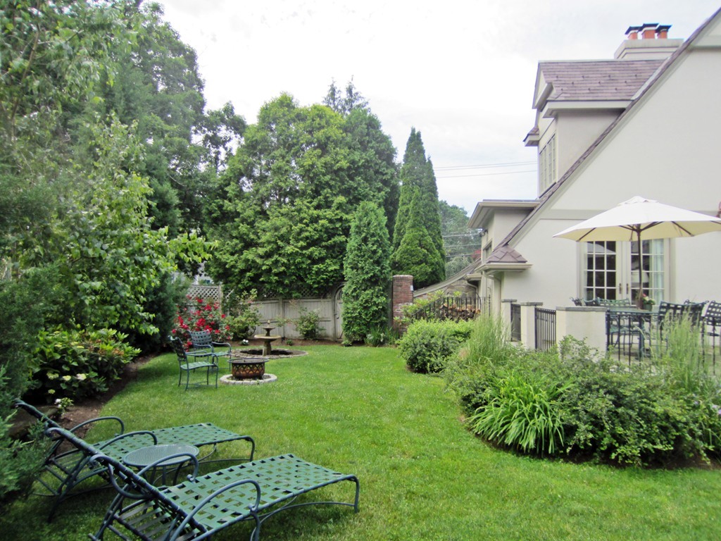 77 Cliff Road Wellesley, MA 02481 - Photo 24 of 29 a view of a house with a yard and sitting area
