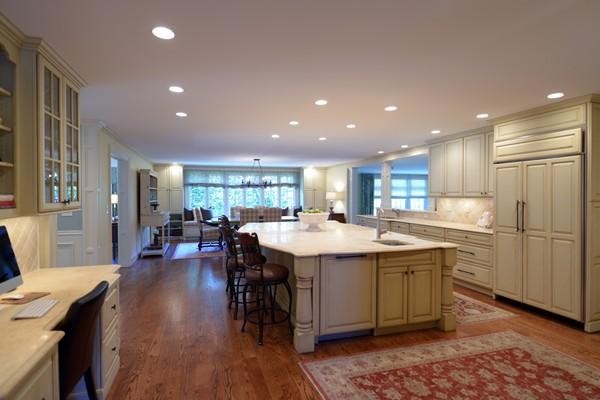 77 Cliff Road Wellesley, MA 02481 - Photo 8 of 29 a kitchen with lots of counter top space and painting on the wall