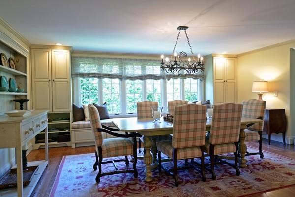 77 Cliff Road Wellesley, MA 02481 - Photo 10 of 29 a dining room with furniture a chandelier and wooden floor