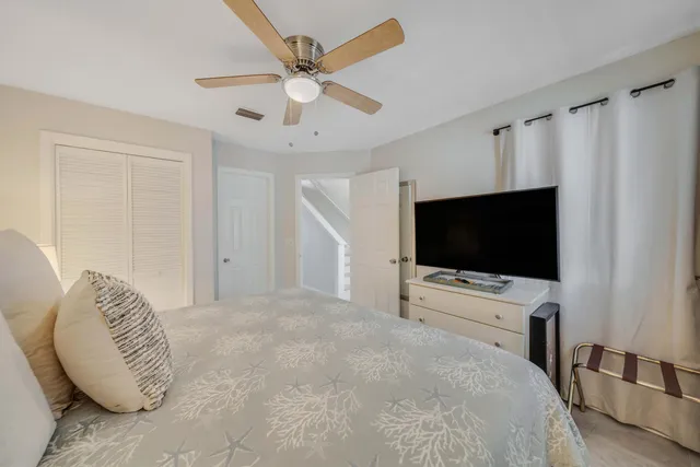 a hotel room with a bed and a flat screen tv