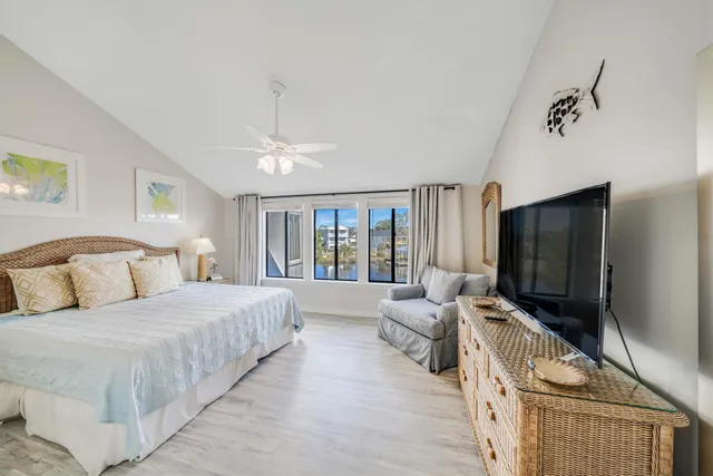 a bedroom with double bed and a flat screen tv