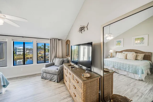 a spacious bedroom with a large bed and a couch