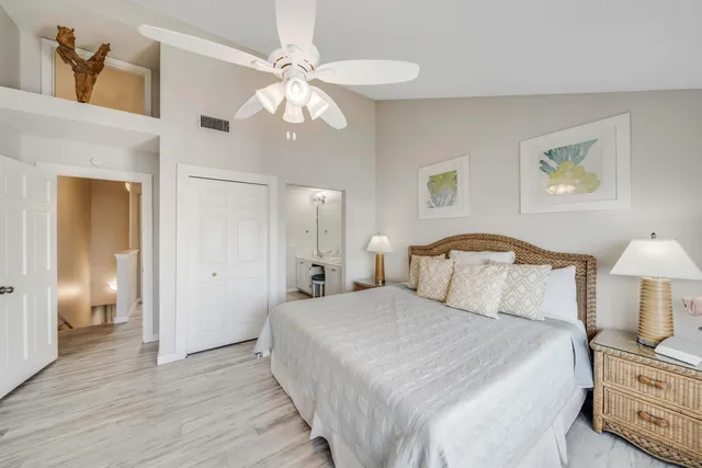 a bedroom with a bed and a lamp