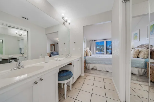 a spacious bathroom with a sink and a mirror