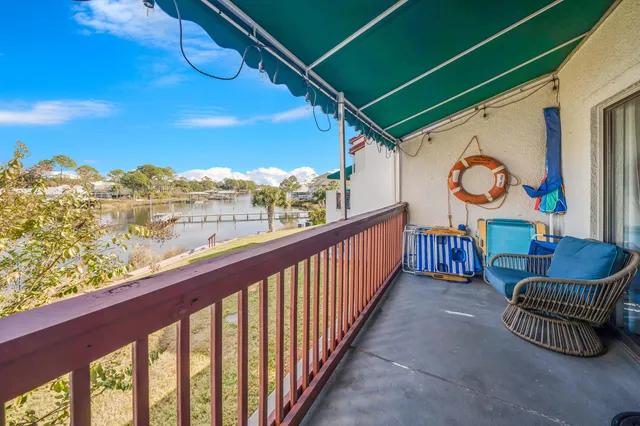 a view of two chairs in the balcony