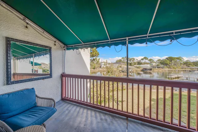 a view of a balcony with furniture