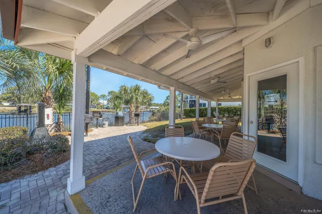 a patio with yard table and chairs