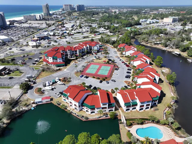 an aerial view of a swimming pool patio and outdoor seating