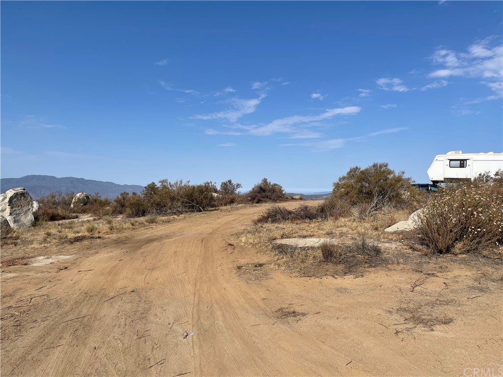 3 Fretag Road Hemet, CA 92544 - Photo 2 of 8 a view of a dry field with trees in the background