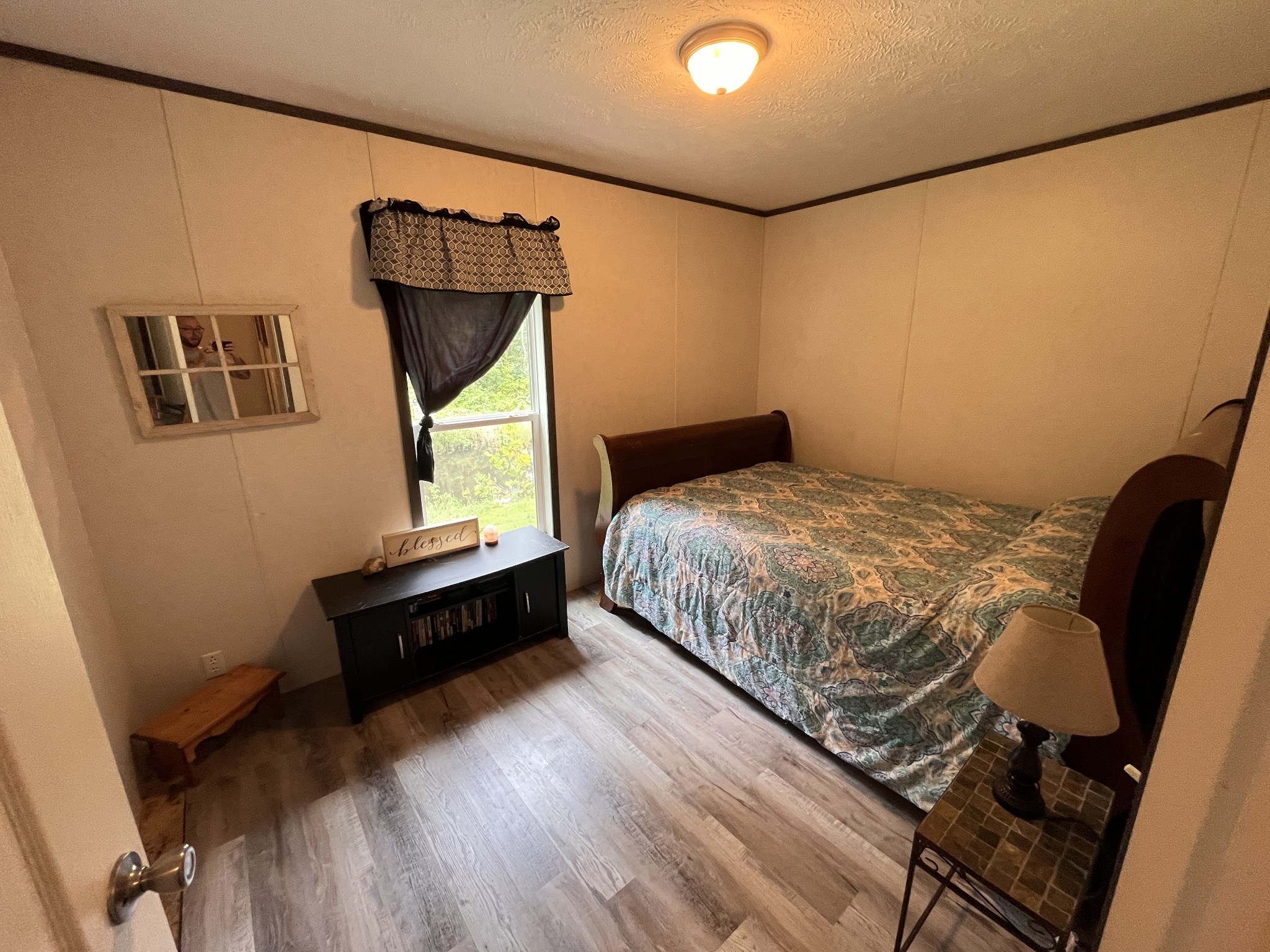 908 Shed Road Manchester, TN 37355 - Photo 11 of 16 a bedroom with a bed and wooden floor
