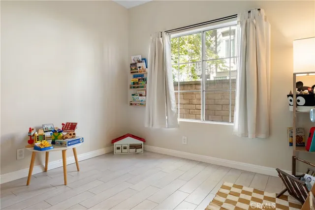 a room with toys and dresser