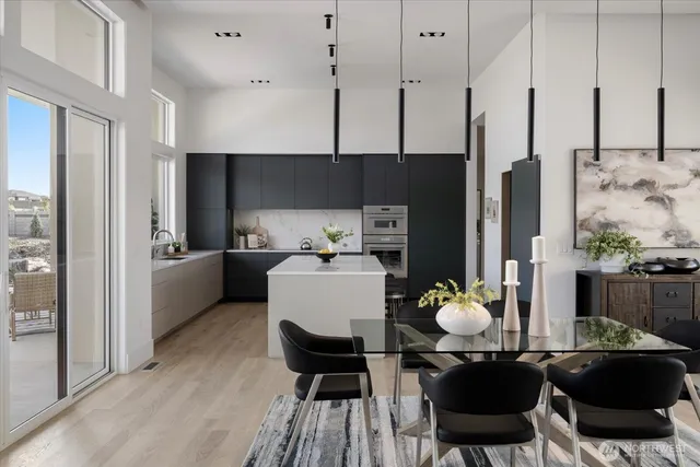 a view of kitchen and dining area with furniture