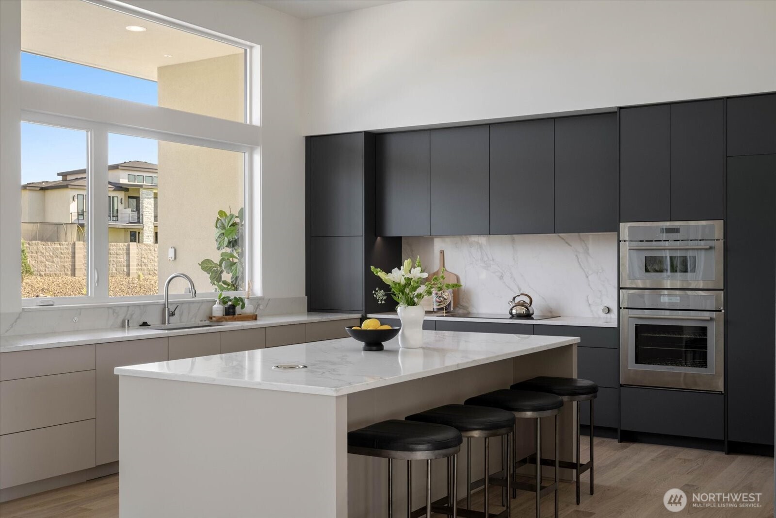 104118 East Addison Avenue Kennewick, WA 99338 - Photo 12 of 40 a kitchen with a sink cabinets and window