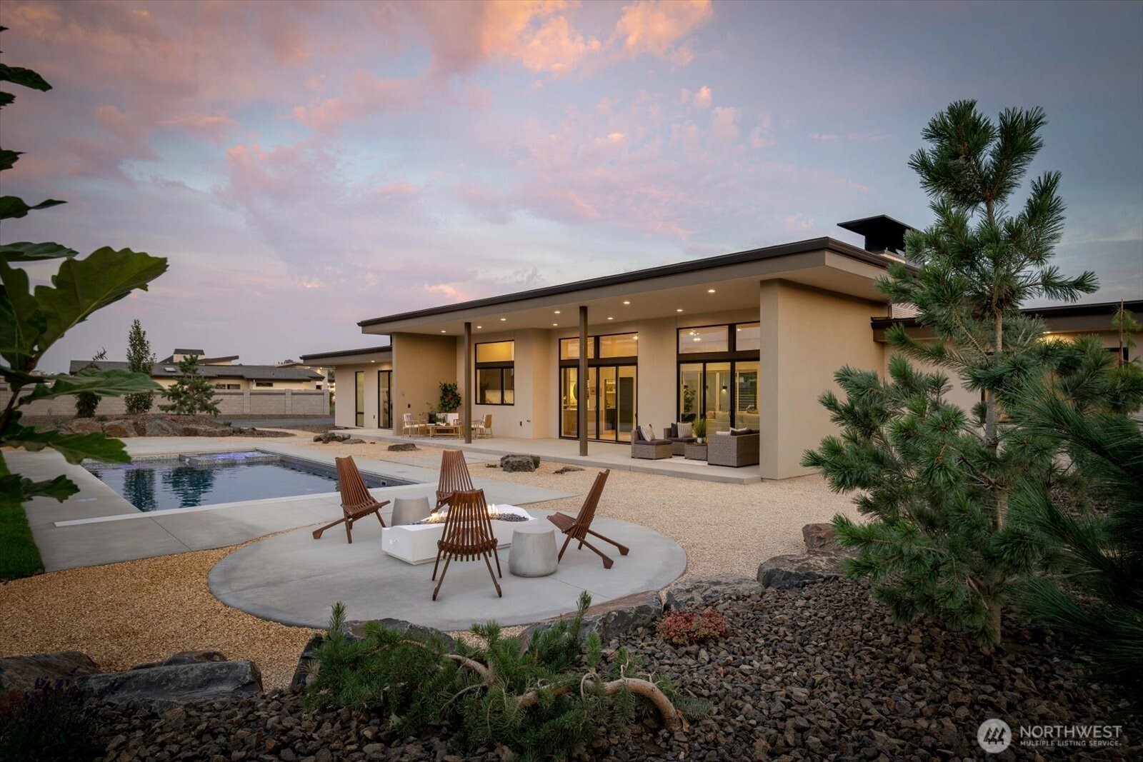 104118 East Addison Avenue Kennewick, WA 99338 - Photo 2 of 40 a view of a patio with table and chairs and potted plants