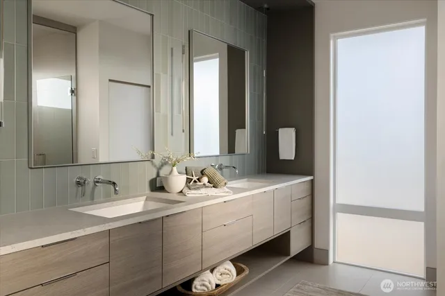 a bathroom with a double vanity sink and mirror