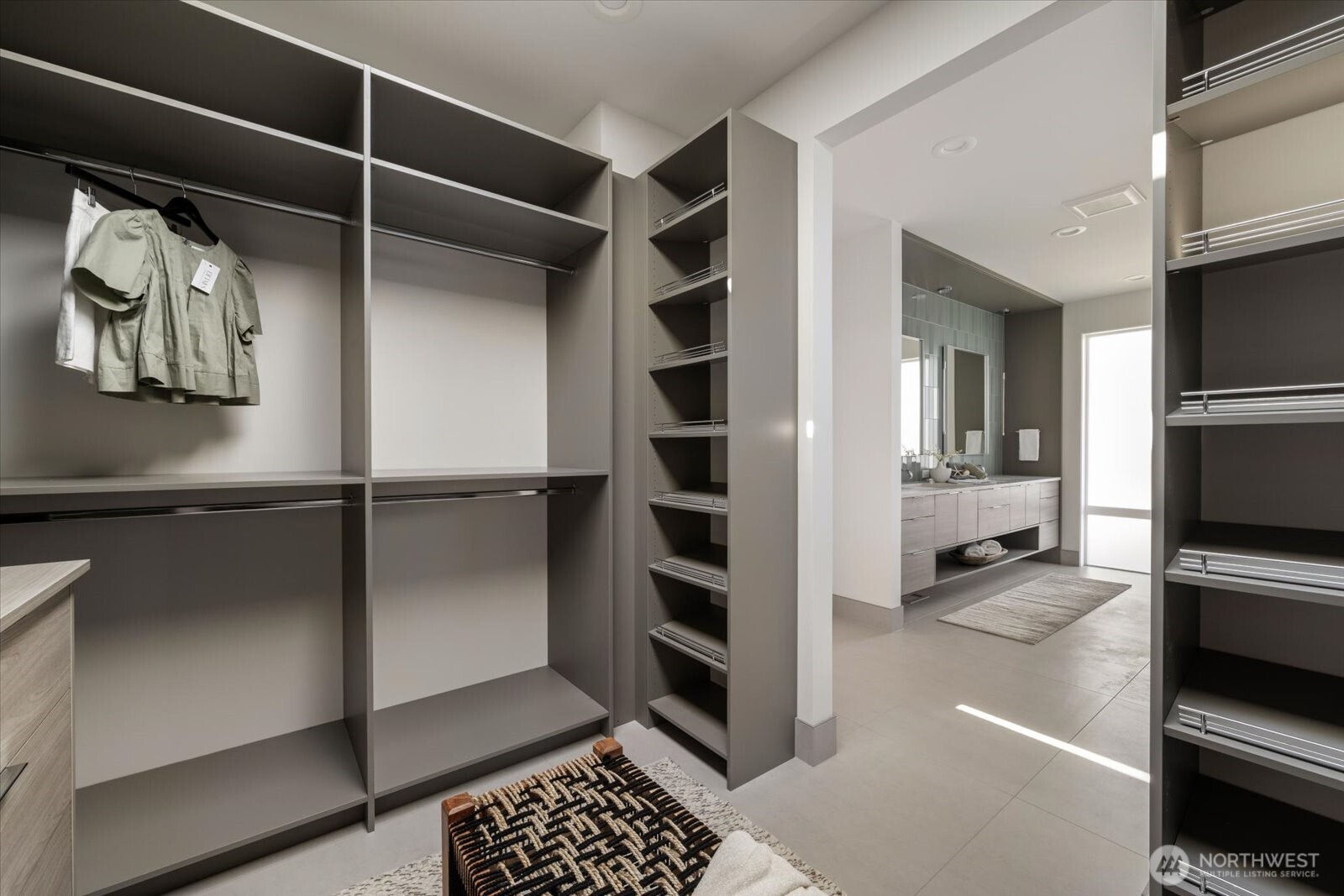 104118 East Addison Avenue Kennewick, WA 99338 - Photo 22 of 40 a view of walk in closet with clothes and shoes
