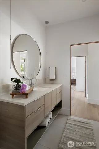 a bathroom with a sink and a mirror