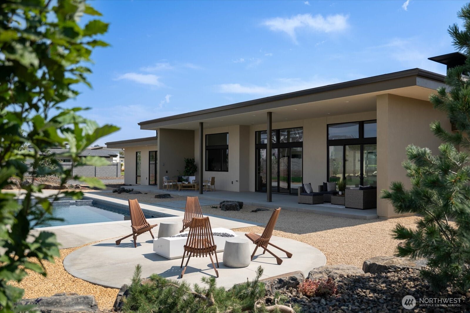 104118 East Addison Avenue Kennewick, WA 99338 - Photo 32 of 40 a building outdoor space with patio furniture and potted plants