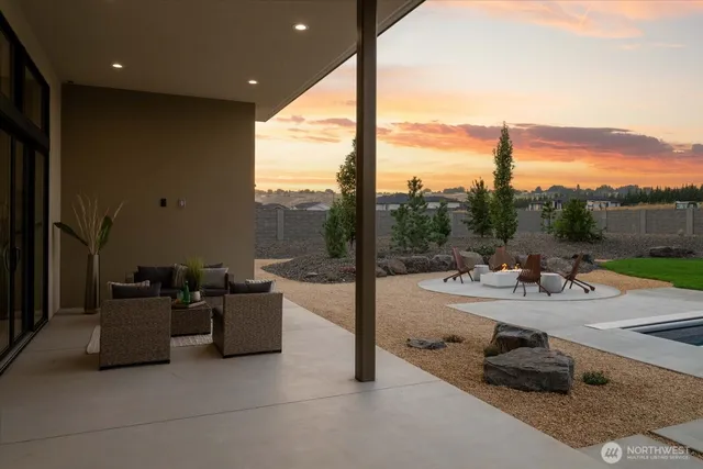 a view of a patio with couches and table and chairs