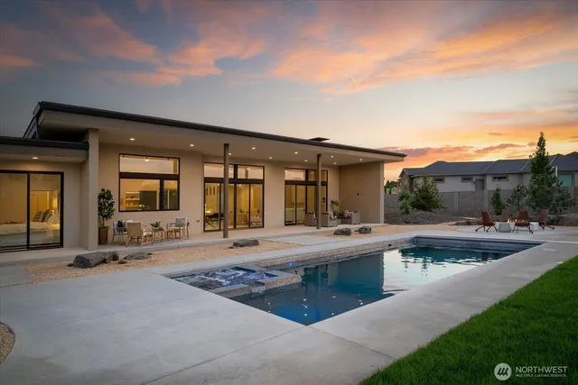 a view of a house with sitting area and garden