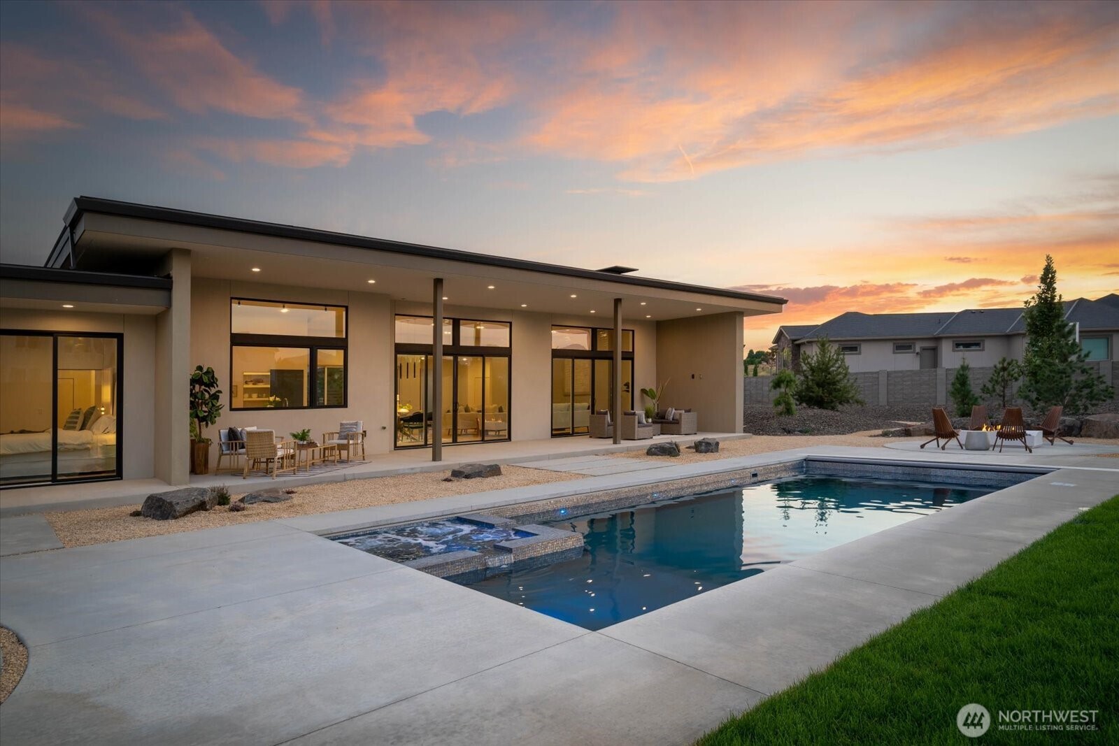 104118 East Addison Avenue Kennewick, WA 99338 - Photo 35 of 40 a view of a house with sitting area and garden