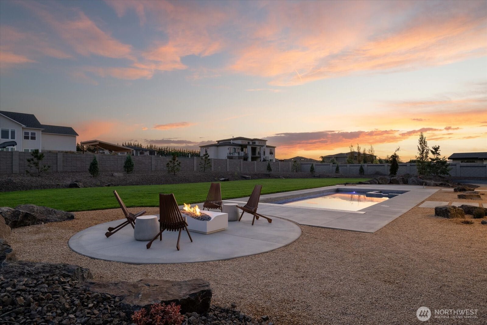 104118 East Addison Avenue Kennewick, WA 99338 - Photo 39 of 40 a view of a swimming pool with a patio and a garden