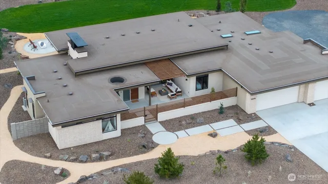 an aerial view of a house with a yard