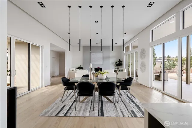 a dining room with furniture and wooden floor