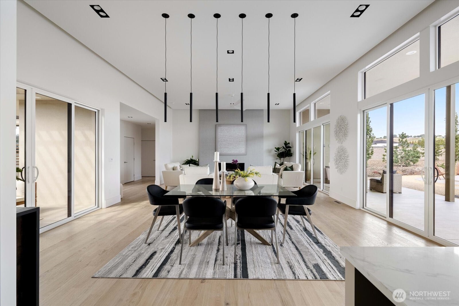104118 East Addison Avenue Kennewick, WA 99338 - Photo 9 of 40 a dining room with furniture and wooden floor