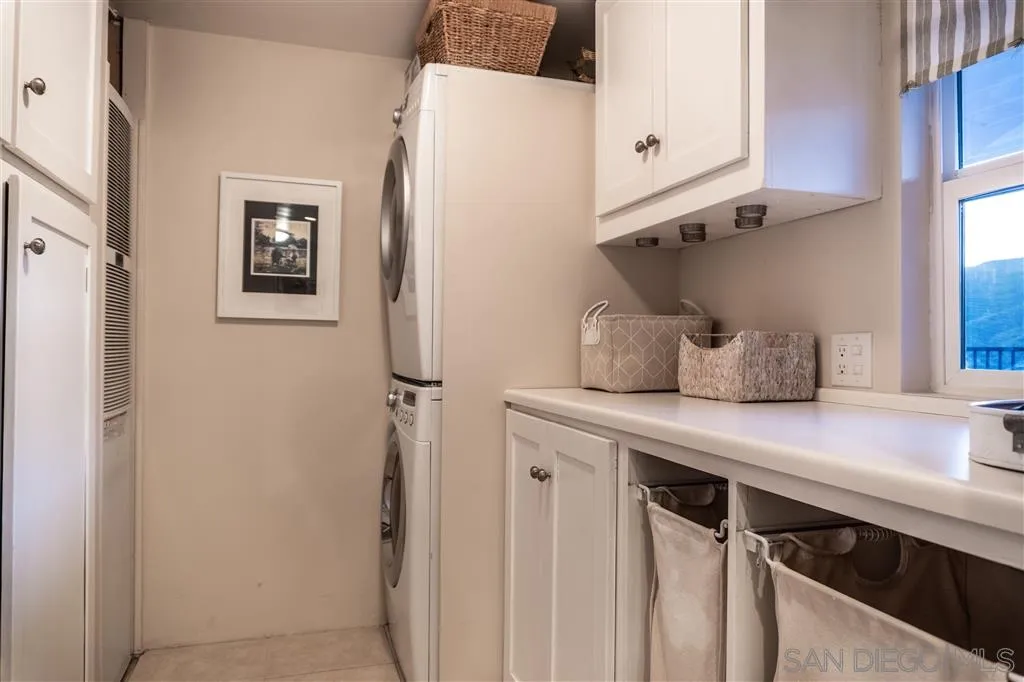 39325 De Luz Road Fallbrook, CA 92028 - Photo 14 of 25 a kitchen with stainless steel appliances a refrigerator and cabinets
