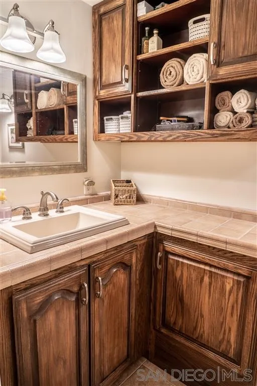 39325 De Luz Road Fallbrook, CA 92028 - Photo 20 of 25 a utility room with a sink a washer and dryer