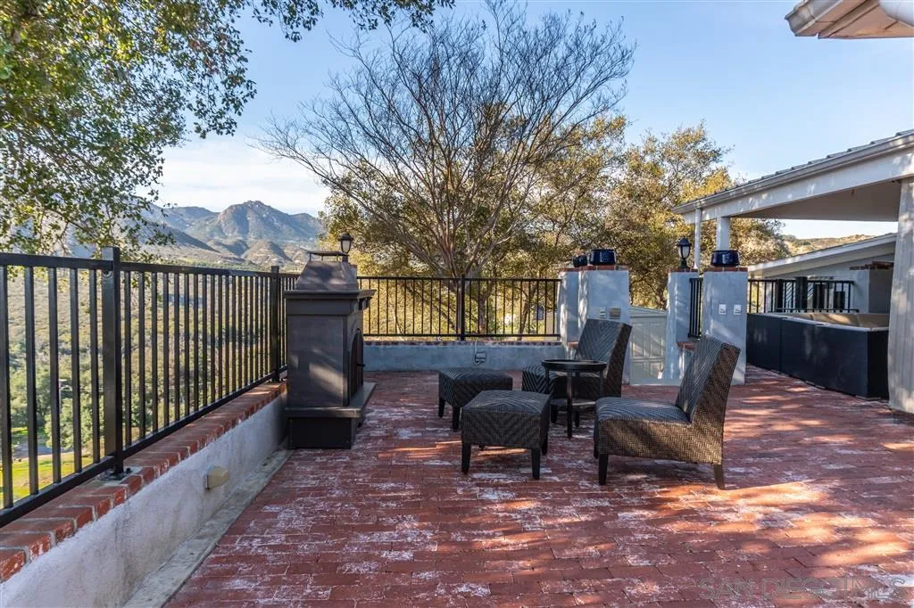 39325 De Luz Road Fallbrook, CA 92028 - Photo 22 of 25 a view of a chairs and tables in the back yard of the house