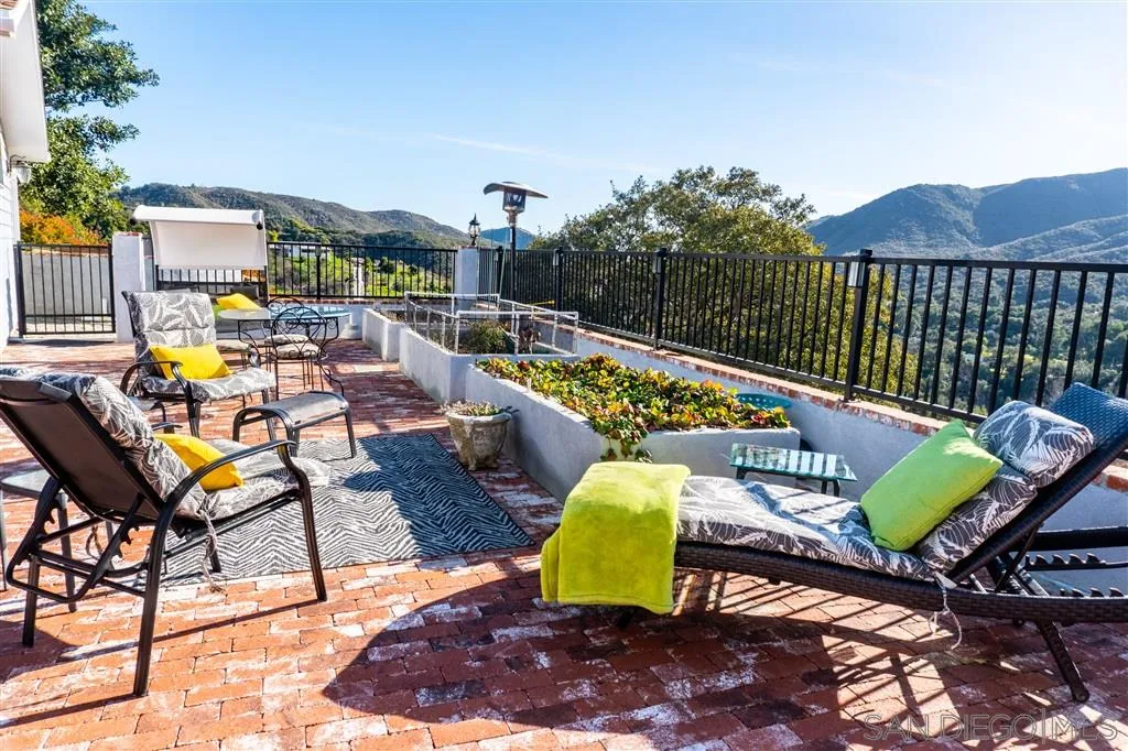 39325 De Luz Road Fallbrook, CA 92028 - Photo 23 of 25 a view of a swimming pool with chairs in patio