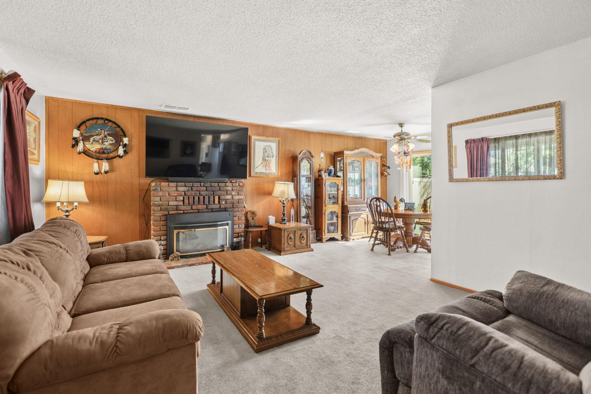 2631 Alfreda Way Redding, CA 96002 - Photo 3 of 16 a living room with furniture fireplace and a flat screen tv