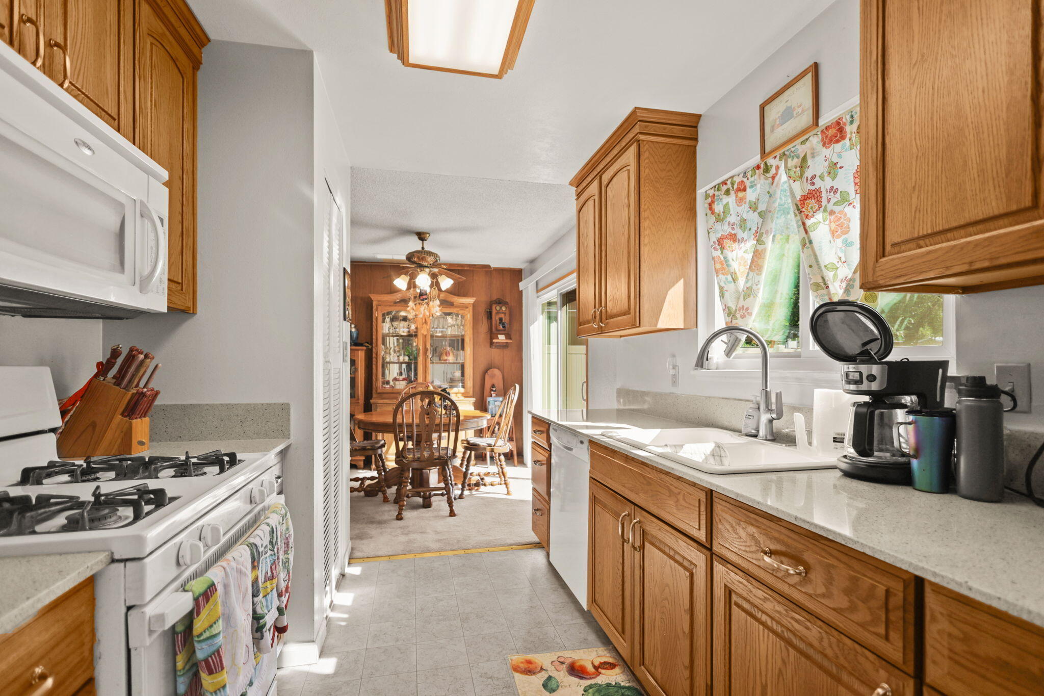 2631 Alfreda Way Redding, CA 96002 - Photo 5 of 16 a kitchen with stainless steel appliances granite countertop a stove and a sink