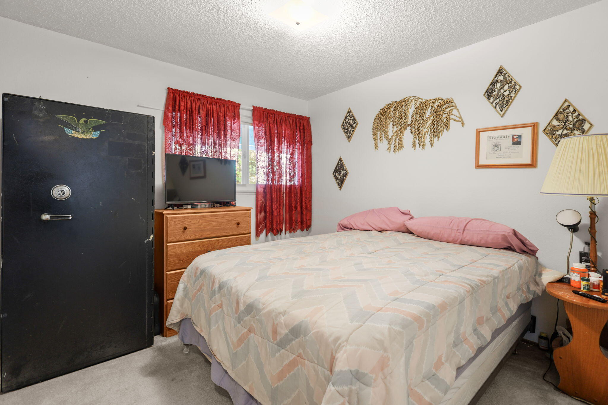 2631 Alfreda Way Redding, CA 96002 - Photo 7 of 16 a bedroom with a bed and a flat screen tv