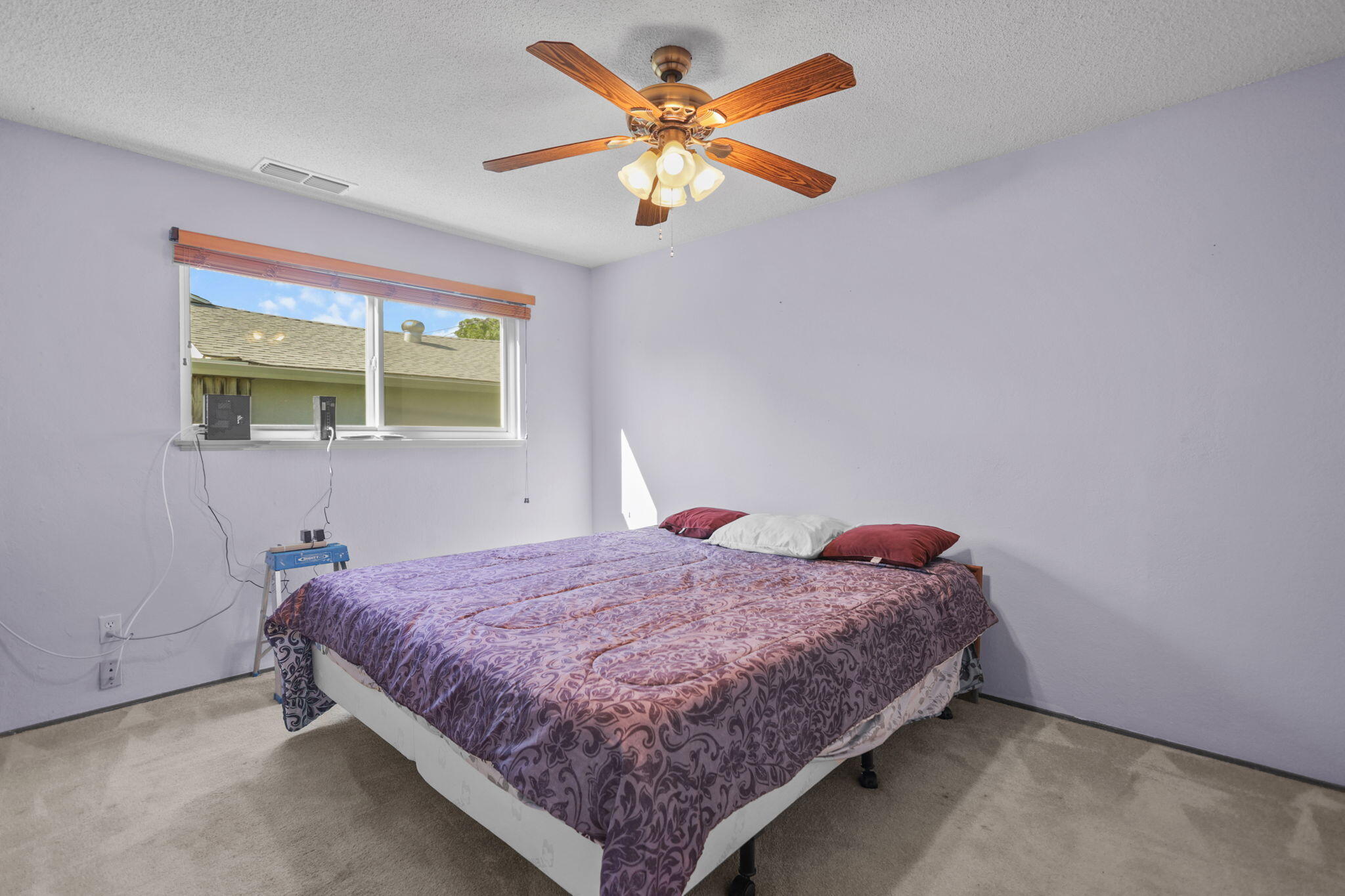 2631 Alfreda Way Redding, CA 96002 - Photo 9 of 16 a bedroom with a bed and window