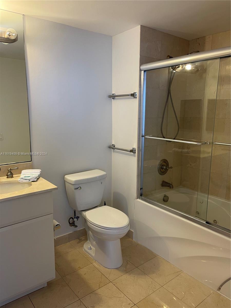 6365 Collins Avenue, Unit 2610 Miami Beach, FL 33141 - Photo 16 of 49 a bathroom with a toilet and a shower