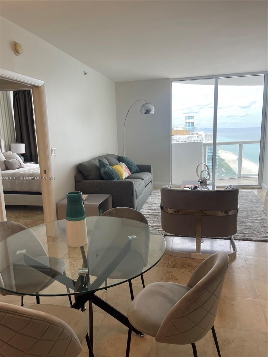 6365 Collins Avenue, Unit 2610 Miami Beach, FL 33141 - Photo 18 of 49 a living room with furniture and a large window