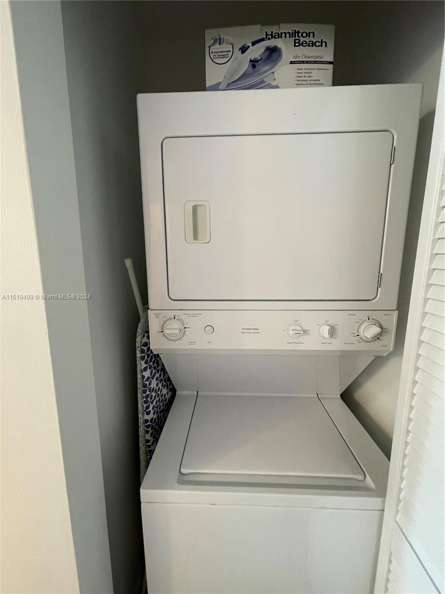6365 Collins Avenue, Unit 2610 Miami Beach, FL 33141 - Photo 24 of 49 a close up view of washer and dryer