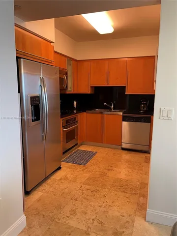 a bathroom with a toilet a sink and shower