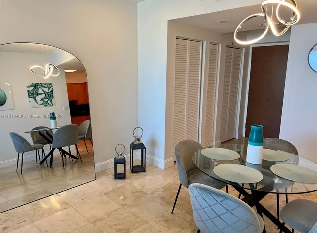 a bedroom with bed and a large window